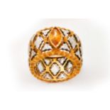 An orange sapphire-set ring, by Mario Buccellati