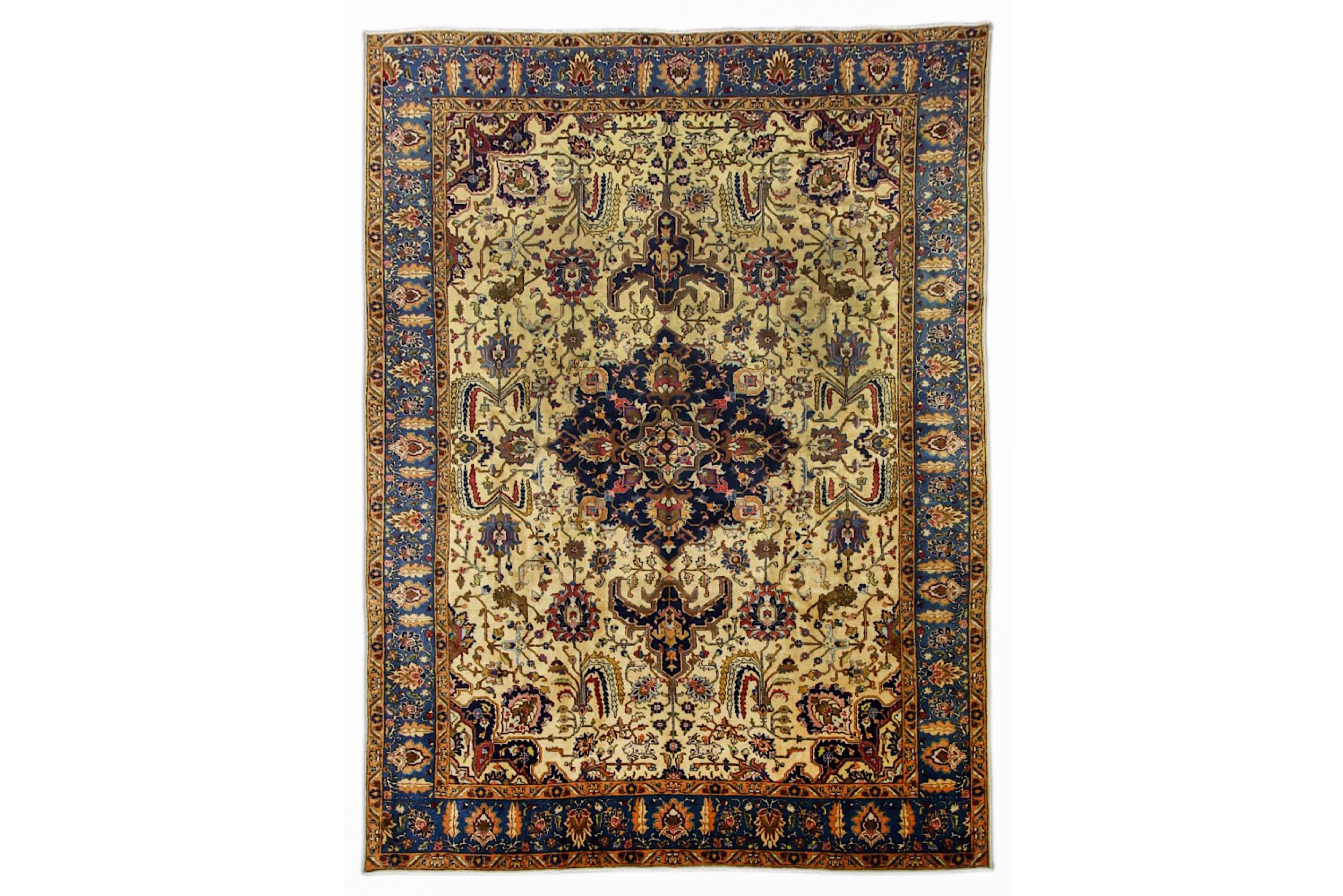 A TABRIZ CARPET, NORTH-WEST PERSIA approx: 12ft.5in. x 9ft.2in.(379cm. x 279cm.) The sandy-beige