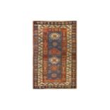 AN ANTIQUE KAZAK RUG, SOUTH CAUCASUS approx; 5ft.1in. x 3ft.3in.(155cm. x 99cm.) The blue field with