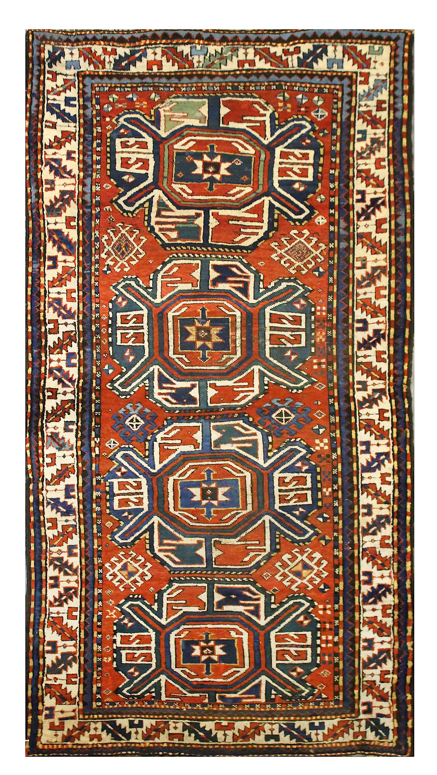 AN ANTIQUE CHELABERD RUG, SOUTH CAUCASUS approx: 7ft.11in. x 3ft.11in.(241cm. x 119cm.) The field