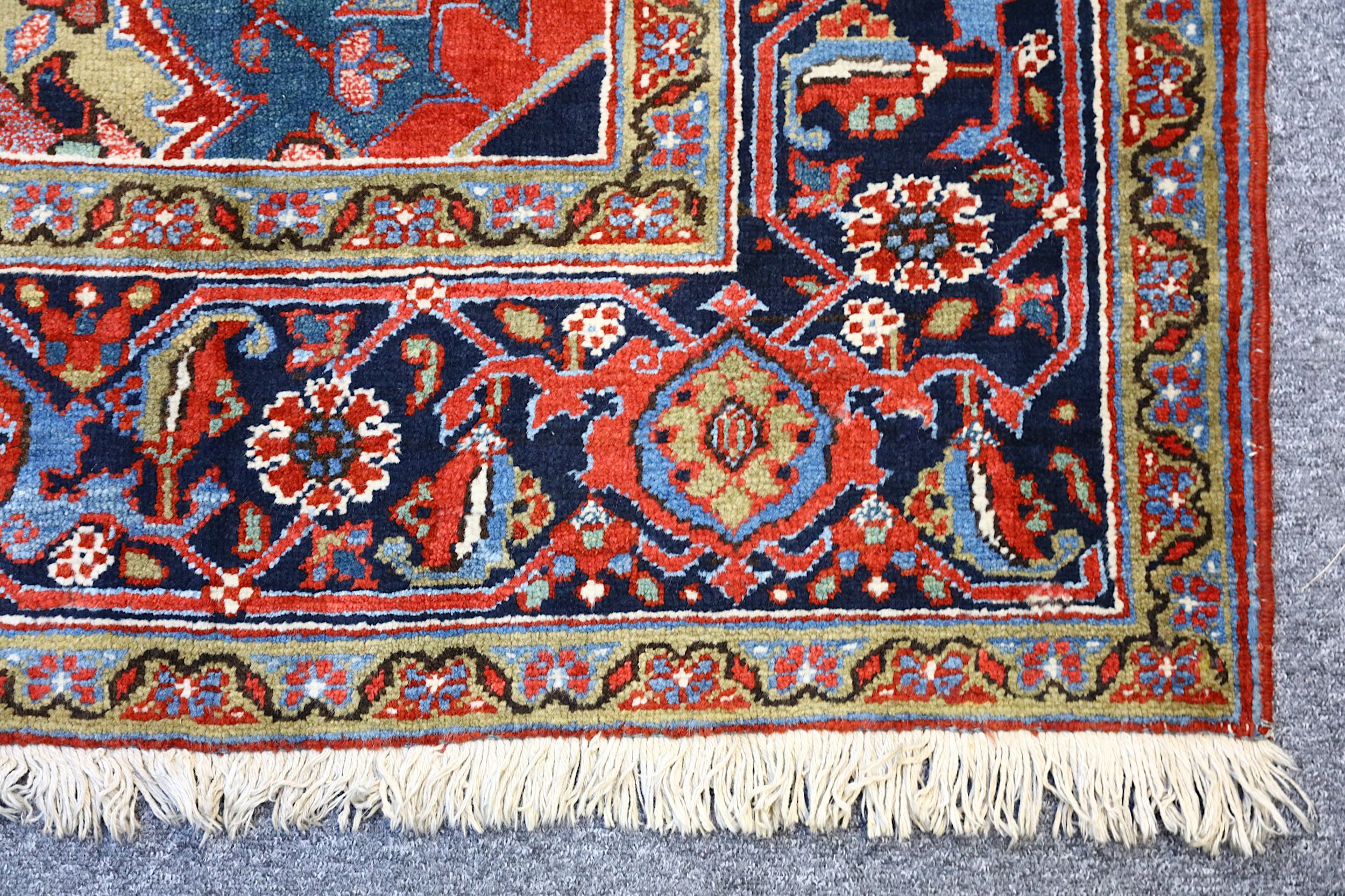 A FINE HERIZ CARPET, NORTH-WEST PERSIA approx: 11ft.3in. x 8ft.6in.(342cm. x 259cm.) The  field with - Image 4 of 5