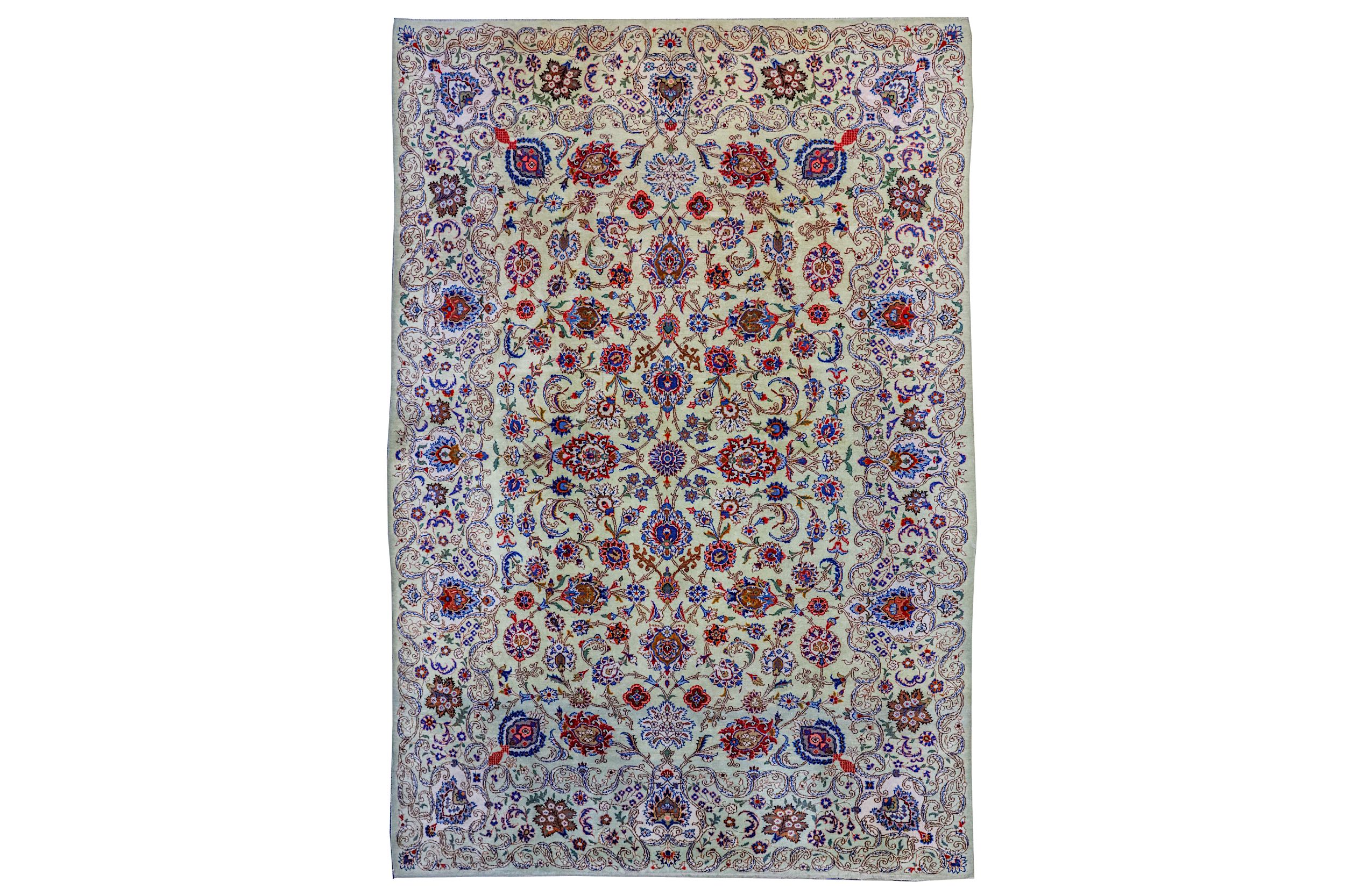 A FINE KASHAN CARPET, CENTRAL PERSIA The shaded light beige field with overall design of various