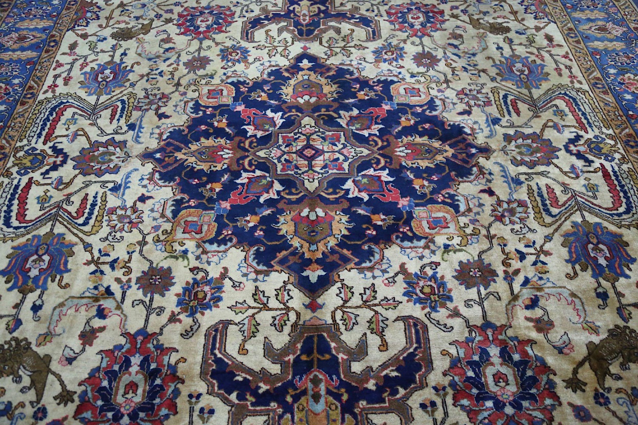 A TABRIZ CARPET, NORTH-WEST PERSIA approx: 12ft.5in. x 9ft.2in.(379cm. x 279cm.) The sandy-beige - Image 7 of 8