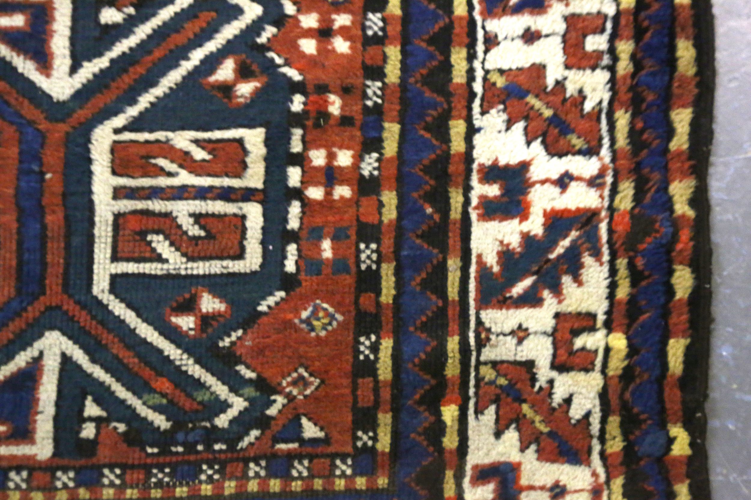 AN ANTIQUE CHELABERD RUG, SOUTH CAUCASUS approx: 7ft.11in. x 3ft.11in.(241cm. x 119cm.) The field - Image 3 of 5
