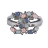 Chanel Gripoix Ring, c. 2017, brushed silver metal with pale blue, green and pink CC design, fits