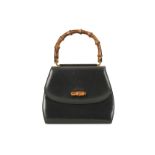 Gucci Black Bamboo Top Handle Bag, c. 1994, smooth leather body with bamboo handle and turn lock,