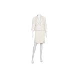 Chanel Cream Boucle Skirt Suit, c. 2017, cream cotton and silk mix, the jacket short with bracelet