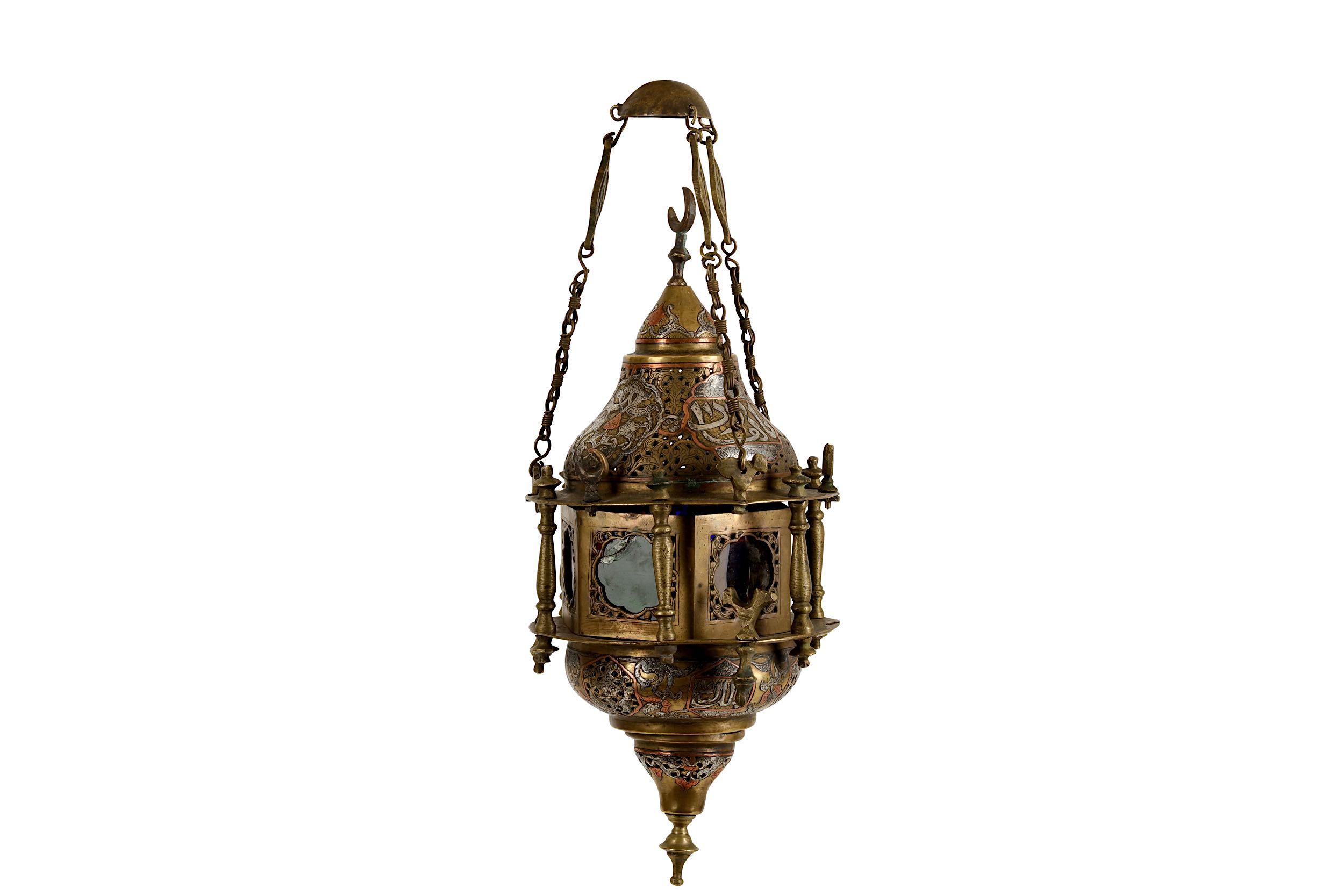 A silver and copper inlaid brass hanging lamp, pos