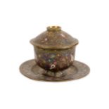A polychrome enamelled brass lidded bowl with dish