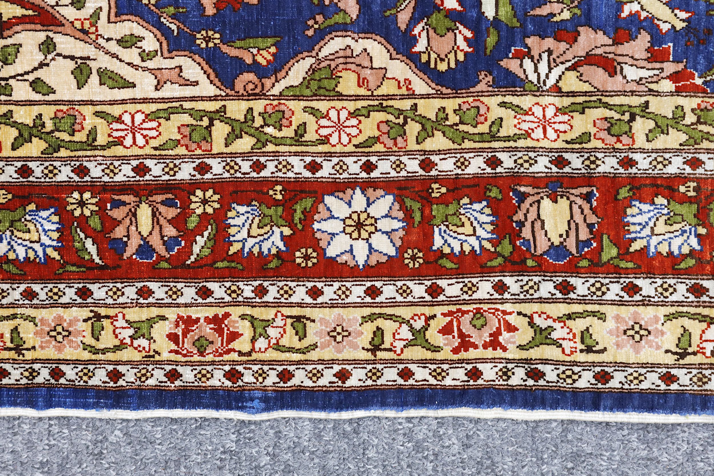 AN EXTREMELY FINE SILK HEREKE RUG, TURKEY approx: 4ft.7in. x 2ft.9in.(140cm. x 84cm.) The field with - Image 3 of 5