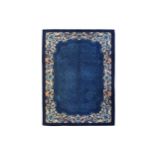 A FINE CHINESE CARPET approx: 11ft.5in. x 8ft.2in.(347cm. x 248cm.) The blue field with stylised