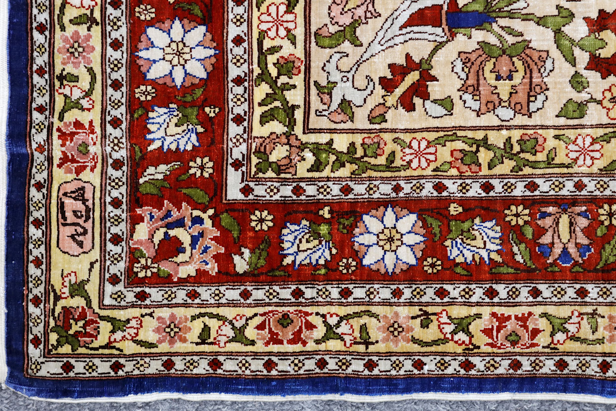 AN EXTREMELY FINE SILK HEREKE RUG, TURKEY approx: 4ft.7in. x 2ft.9in.(140cm. x 84cm.) The field with - Image 4 of 5