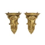 A PAIR OF LATE 19TH CENTURY GILTWOOD WALL BRACKETS MODELLED WITH PUTTI