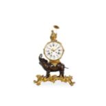 A LOUIS XV STYLE GILT AND PATINATED BRONZE MANTEL CLOCK MODELLED WITH AN ELEPHANT