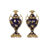 A PAIR OF LOUIS XVI STYLE GILT BRONZE AND GILT HEIGHTENED PORCELAIN LAMP BASES