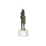 AN EGYPTIAN BRONZE FIGURE OF HARPOCRATES Late Period, Circa 663 - 332 B.C. Depicted striding with