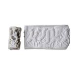 A SUMERIAN STEATITE CYLINDER SEAL First half of 3rd Millennium B.C. Carved in white steatite,