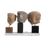 THREE CHALCOLITHIC TERRACOTTA HEADS Circa 5th - 4th Century B.C. All three with highly stylised