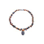 A LAPIS LAZULI AND CARNELIAN NECKLACE Circa 1st Millennium B.C. Re-strung, composed of various lapis