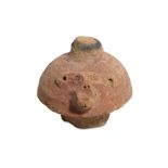 AN EGYPTIAN TERRACOTTA CANOPIC JAR LID New Kingdom, Circa 1550 - 1069 B.C. In the form of baboon-