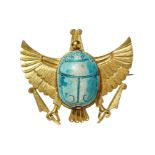 A SCARAB BROOCH Mounted on a modern gold setting in the form of wings surmounting two talons