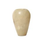 A SMALL EGYPTIAN CALCITE VESSEL Circa 1st Millennium B.C. In the form of a miniature canopic jar