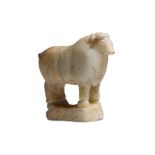 A SOUTH ARABIAN ALABASTER BULL Circa 1st Century B.C. - 1st Century A.D. Standing on an integral