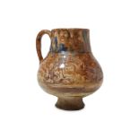 A RAQQA COPPER-LUSTRE POTTERY JUG Syria, 13th cent