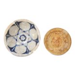 AN ABBASID BLUE AND WHITE POTTERY DISH AND AN IRAN