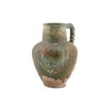 A BLACK-PAINTED TURQUOISE-GLAZED WATER JUG Possibl