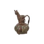 A MINIATURE BRONZE JUG North-Eastern Iran, 12th -