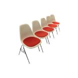 5x Herman Miller fibreglass stacking chairs in cream and orange.