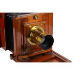 A Whole Plate Mahogany Studio Camera with Anachromatic Brass Lens