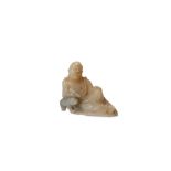 A SMALL CHINESE SOAPSTONE FIGURE OF A LOHAN.