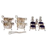 An Edwardian sterling silver table condiment service, the majority London 1909