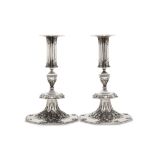 A large pair of George V sterling silver revivalist candlesticks, London 1935 by Richard Comyns