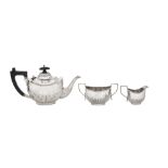 An Edwardian sterling silver bachelor tea set, Birmingham 1914 by Henry Mathews