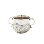 A Charles II sterling silver twin handled porringer, London 1671 by RL rosette and pellets below, as