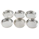 A set of six Elizabeth II sterling silver coasters, London 1969 by Garrard