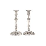 A matched pair of George IV / Victorian sterling silver candlesticks, one Sheffield 1829 by Sansom &