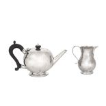 A George V sterling silver bullet teapot, London 1922 by the Pairpoint Brothers