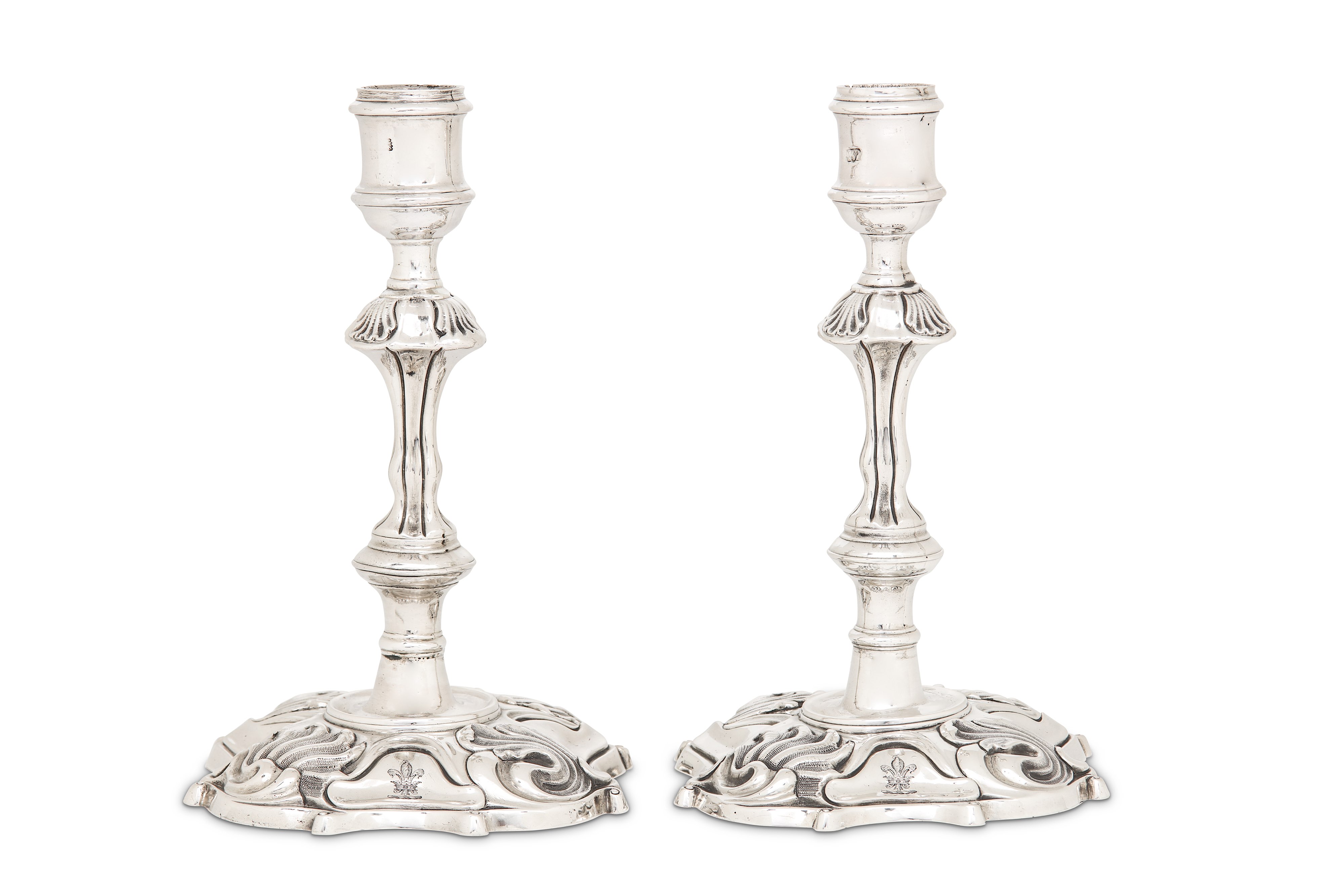 A matched pair of George III sterling silver candlesticks, one London 1742 by Philip Garden, the oth