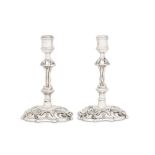 A matched pair of George III sterling silver candlesticks, one London 1742 by Philip Garden, the oth