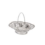 A George III sterling silver swing handle sweatmeat basket, London 1769 attributed to John Gibson Le