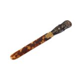 A mid to late 19th century French unmarked gold mounted, pique and tortoiseshell paper knife / page
