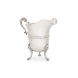 A large Edwardian Scottish sterling silver water jug, in the form of an 18th century Irish cream jug