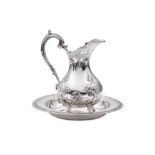 A Victorian sterling silver hot milk jug, London 1869, by Martin, Hall & Co