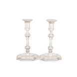 A pair of Edwardian sterling silver candlesticks, London 1906 by Hawksworth, Eyre & Co Ltd