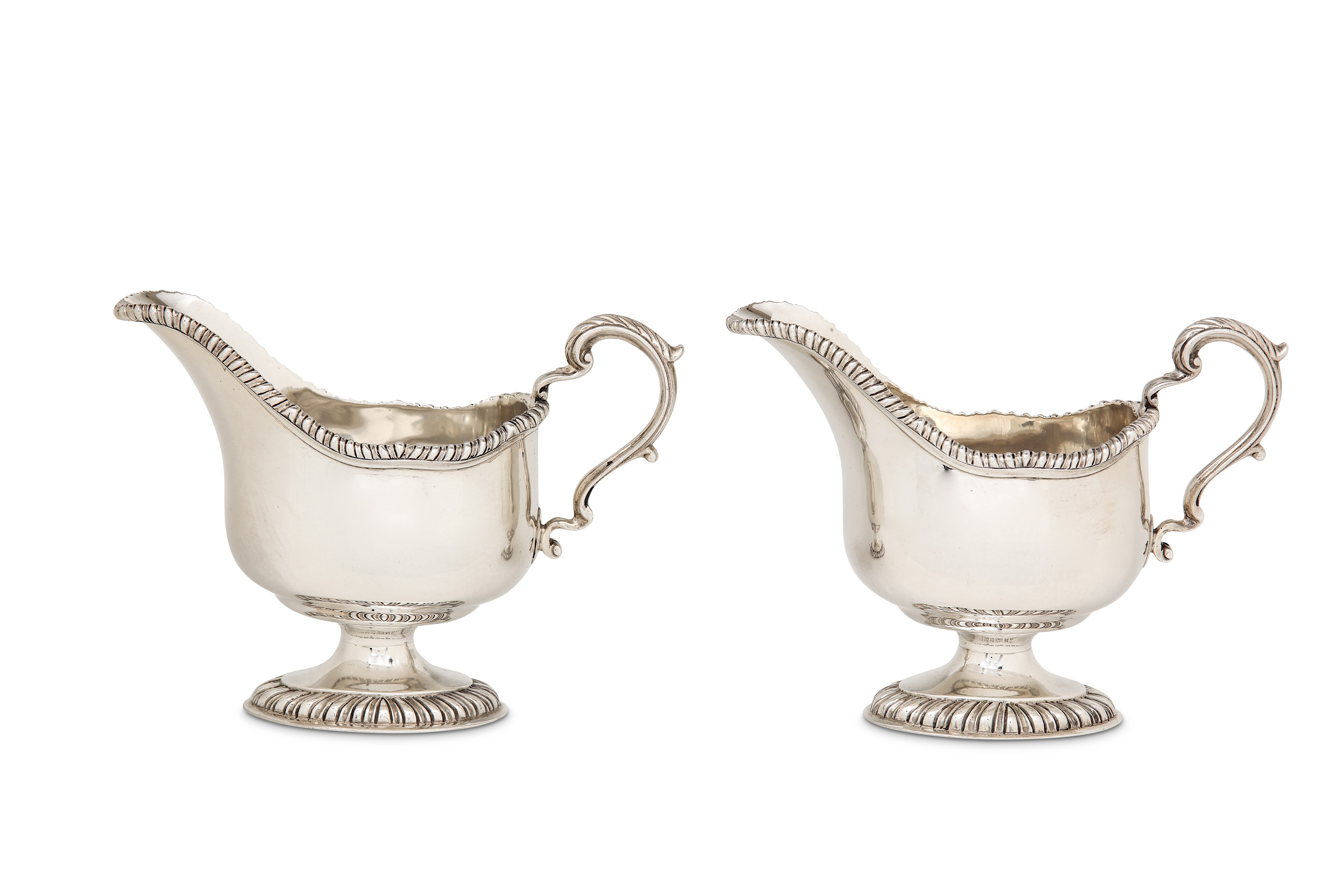 A pair of George V sterling silver sauceboats, London 1926 by Sebastian Garrard