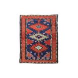 AN UNUSUAL ANTIQUE KURDISH RUG